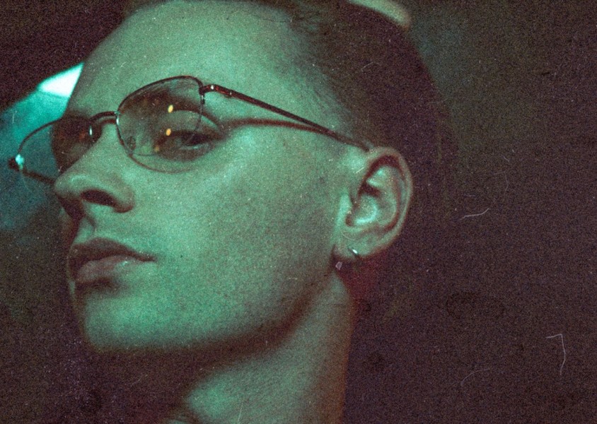 Artist Puma Blue wearing glasses and a silver earringx